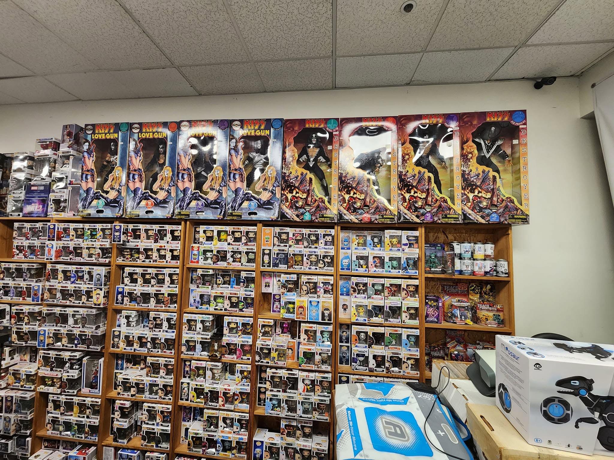 Boxed action figures on the wall